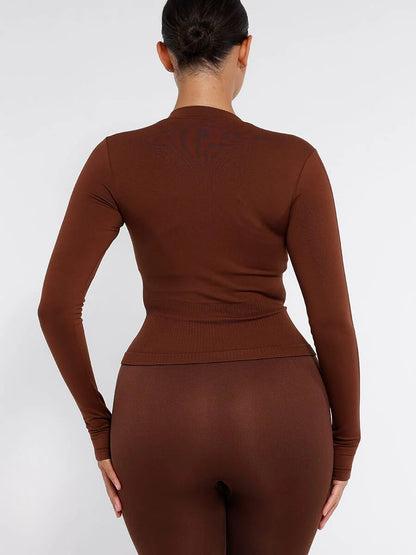 Top de running con cremallera completa sin costuras y orificios para los pulgares