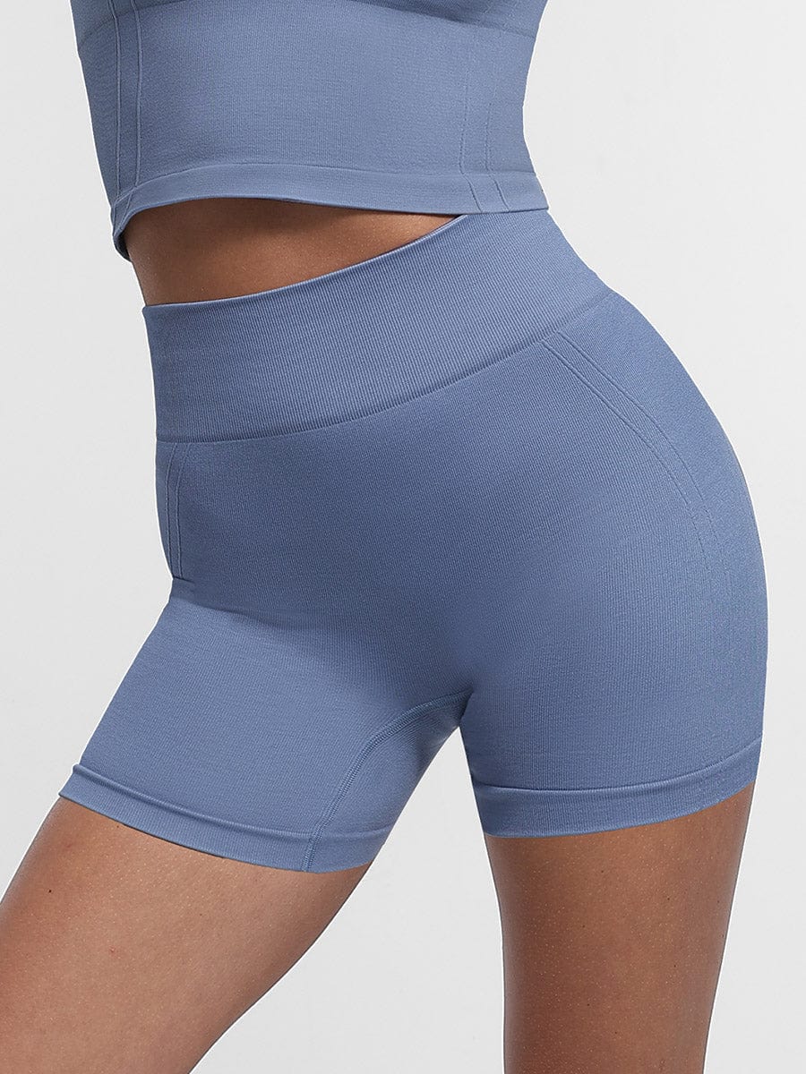 Shorts de yoga de cintura alta sin costuras con efecto moldeador de glúteos en color melocotón