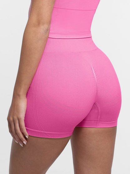 Shorts de yoga de cintura alta sin costuras con efecto moldeador de glúteos en color melocotón