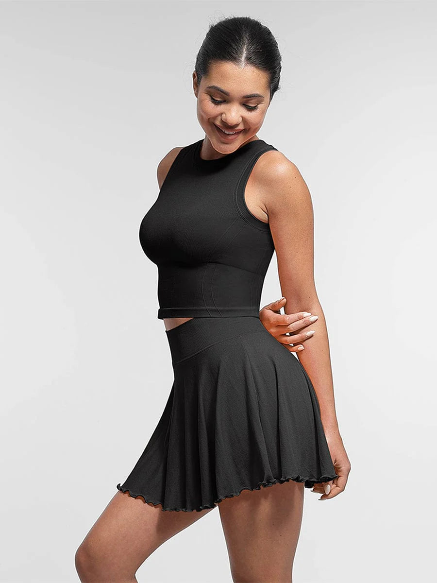 Top deportivo de soporte sin costuras con sujetador incorporado y copas extraíbles.